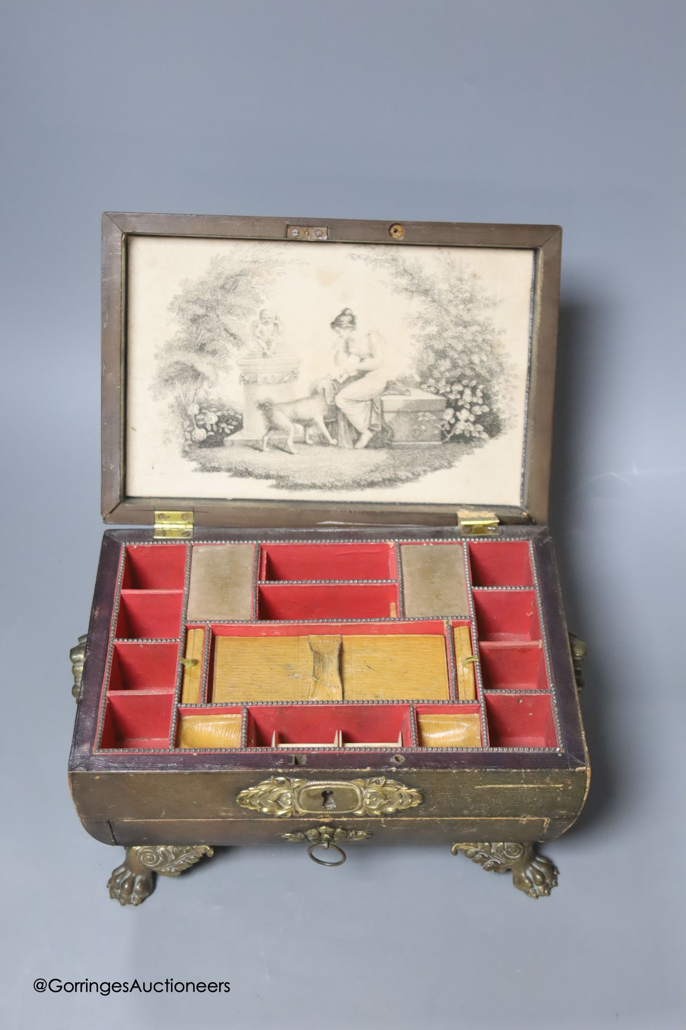 A Regency stamped brass mounted leather covered sewing box, 24cm (a.f.)